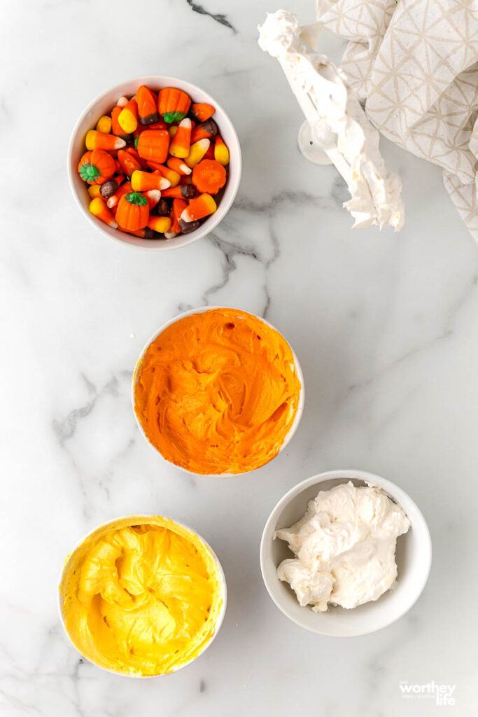 bowls of frosting for candy corn dessert