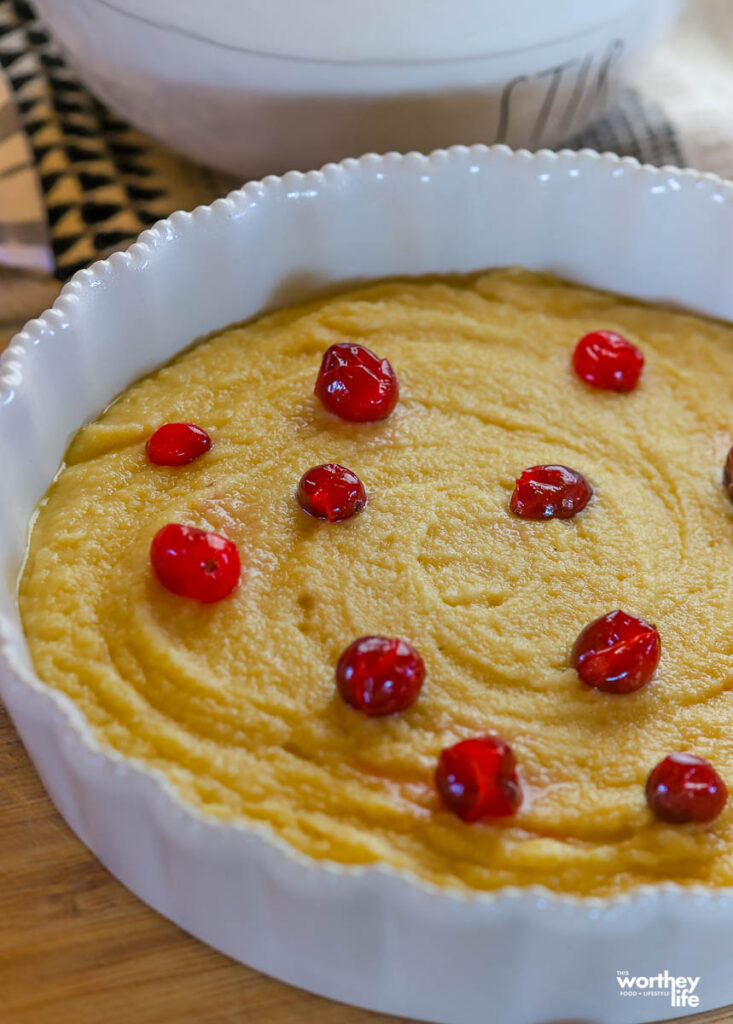 yellowcake with cranberries in a baking pan