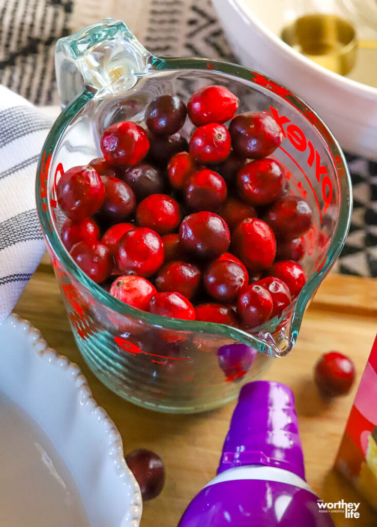 fresh cranberries in a measuring cup