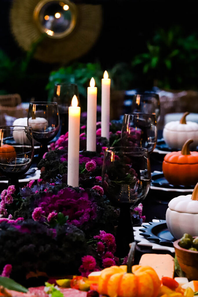 row of tapered candles on table