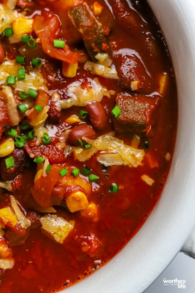 chili topped with chives and cheese