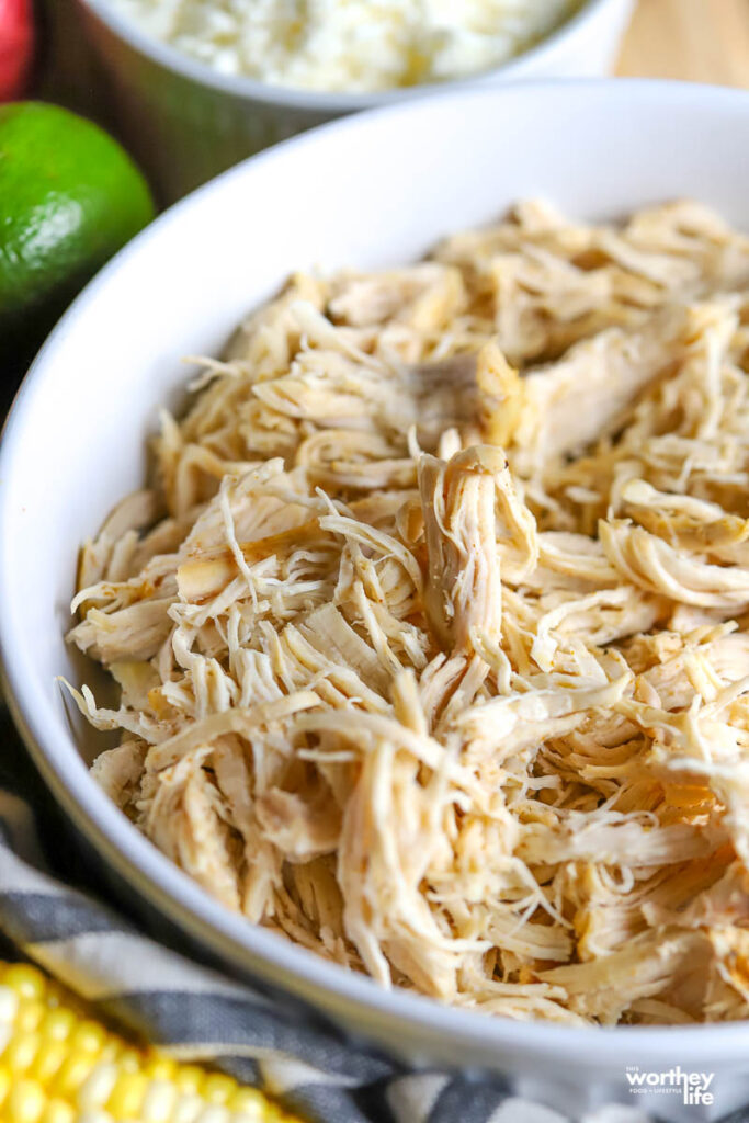 shredded chicken in a white bowl