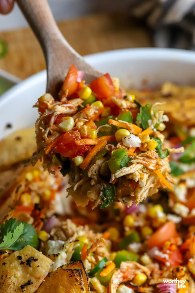 taco casserole with wooden spoon