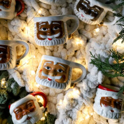 a collection of Black santa mugs