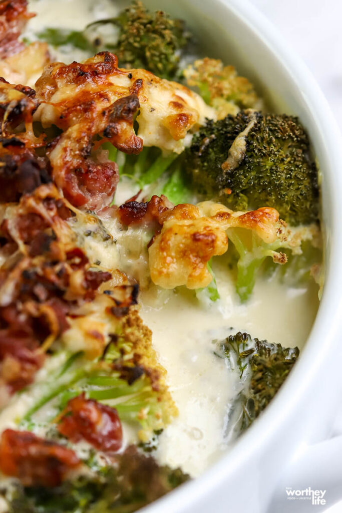 broccoli and prosciutto in white baking pan with cream sauce 
