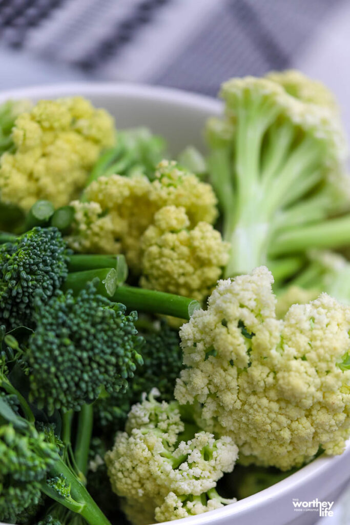 fresh broccoli and cauliflower in white bowl