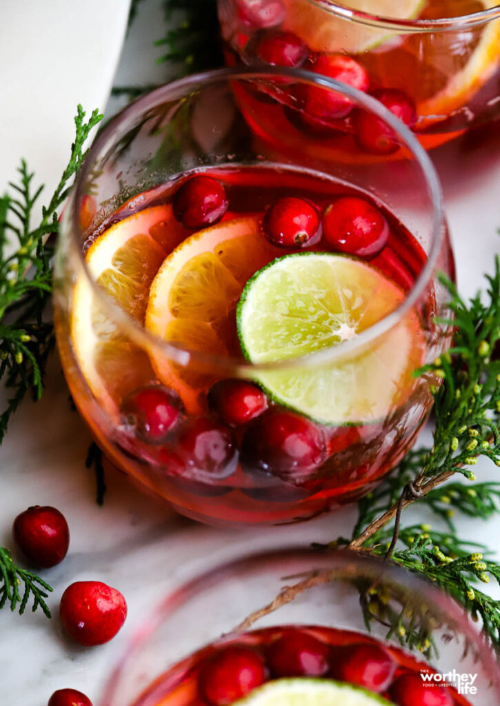  drink in glass with fresh cranberries