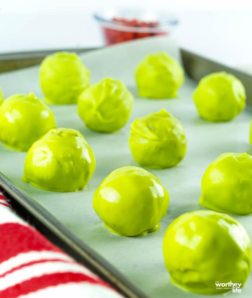 green oreo balls on a sheet pan