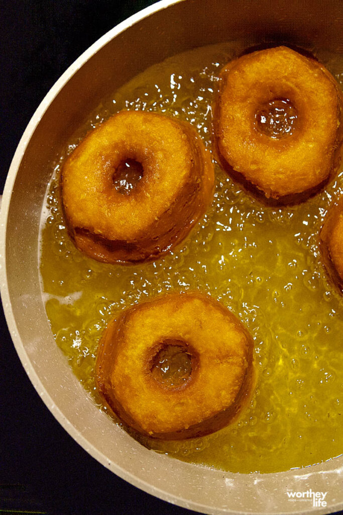 frying doughnuts in a pan