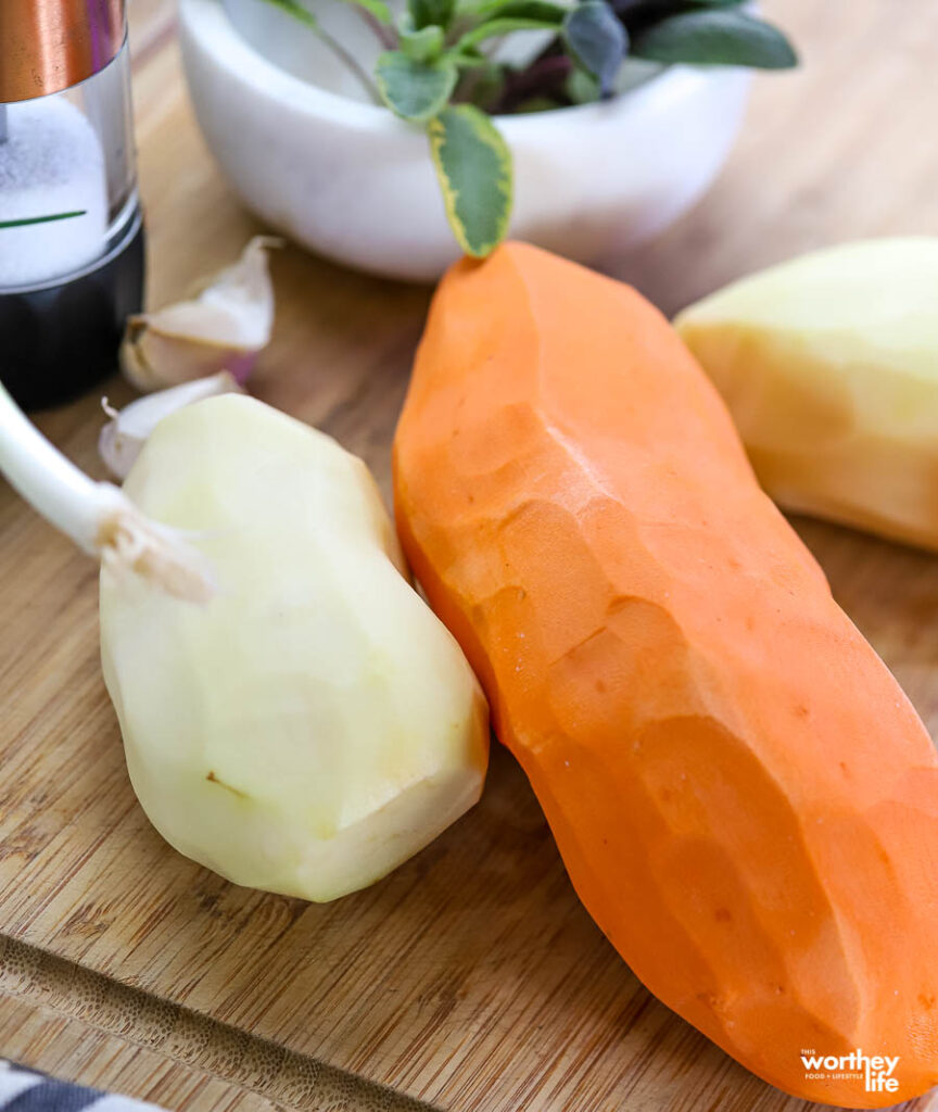 peeled potatoes on cutting board