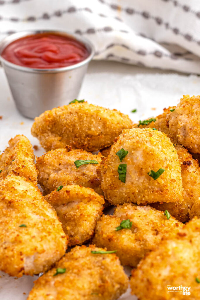 chicken nuggets on plate with dipping sauce