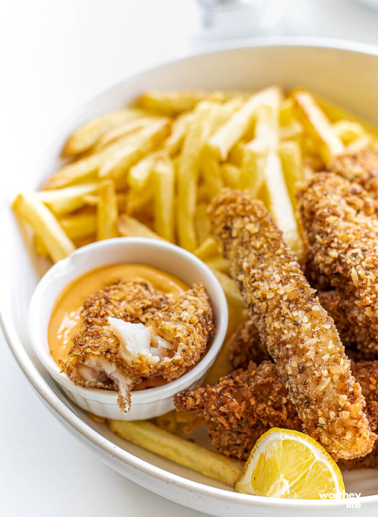fish sticks and fries on white plate