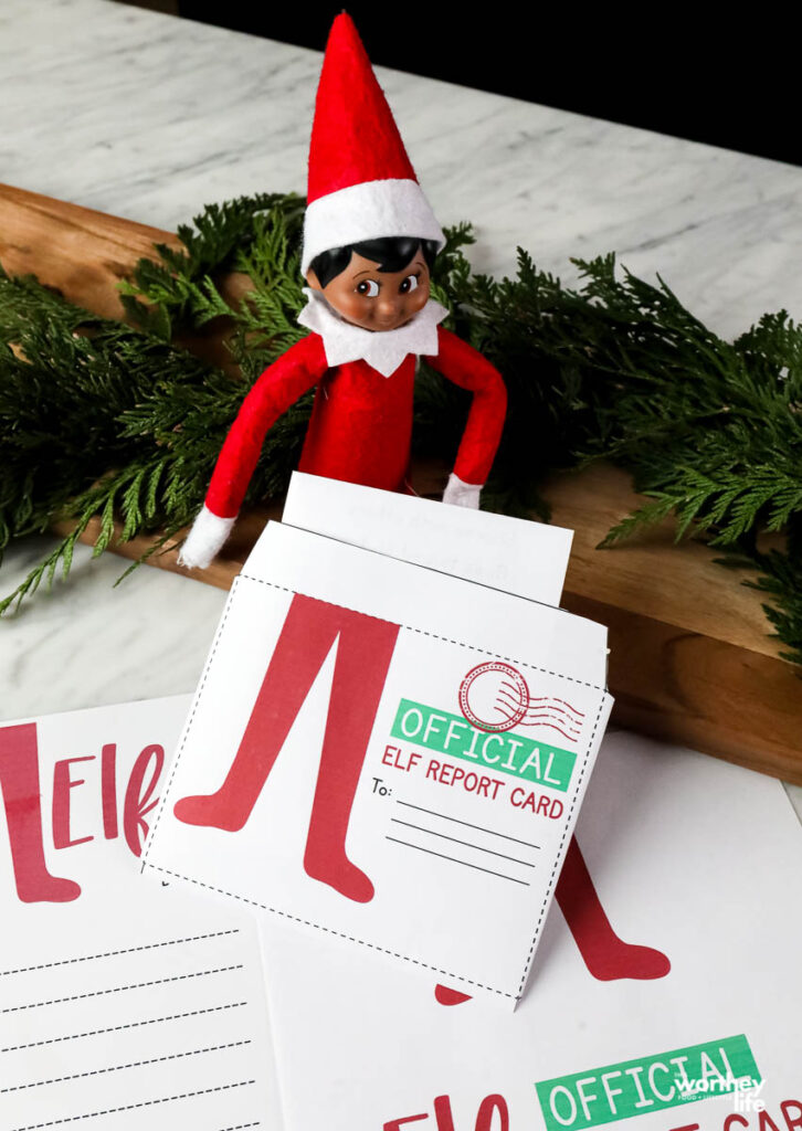 elf on the shelf holding a report for santa