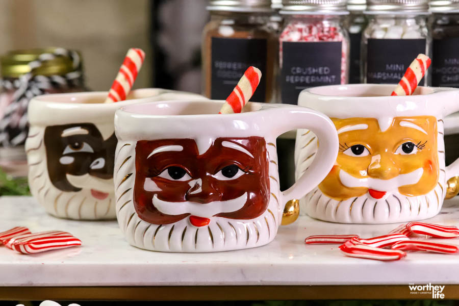 set of santa hot cocoa mugs on counter