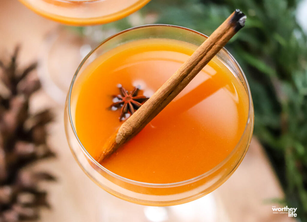 a single coupe glass topped with a persimmon rye cocktail