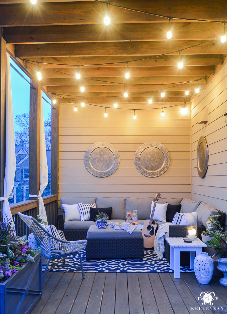 back porch with seating area and twinkling lights