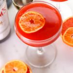orange floating in cocktail