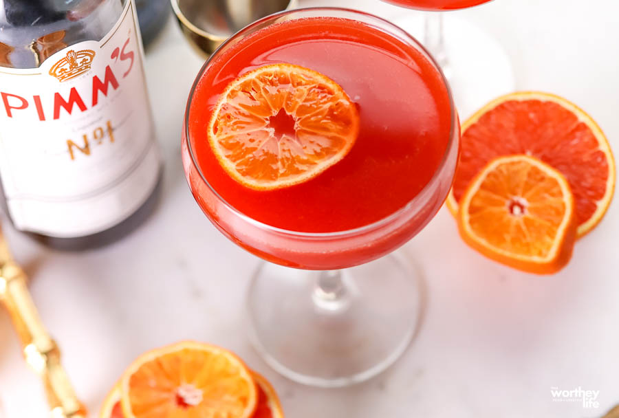 orange floating in cocktail