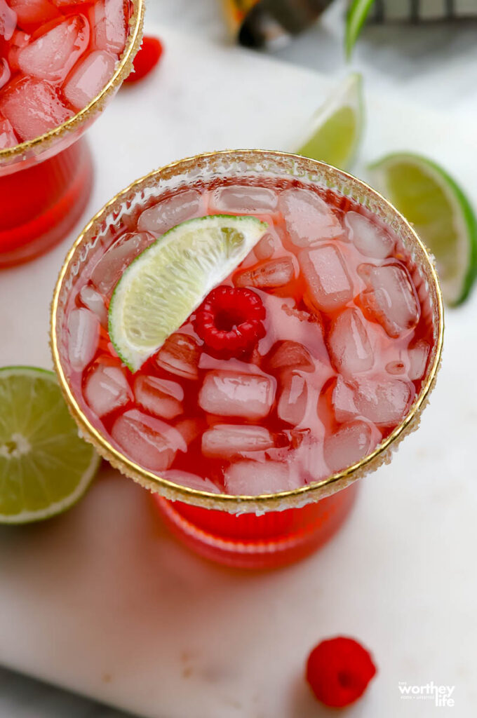 Fresh Raspberry Margarita in cocktail glass with gold rim