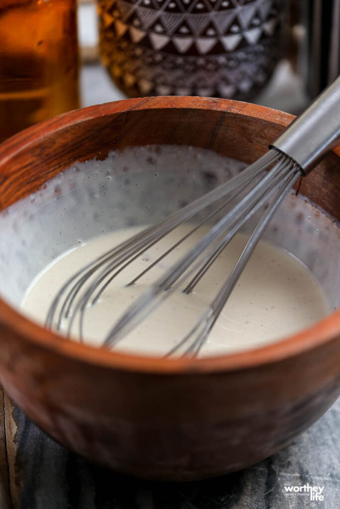 french toast batter in wooden bowl