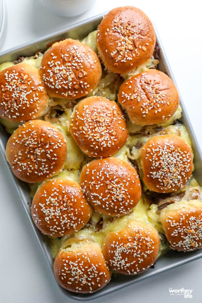 french dip sliders in baking pan