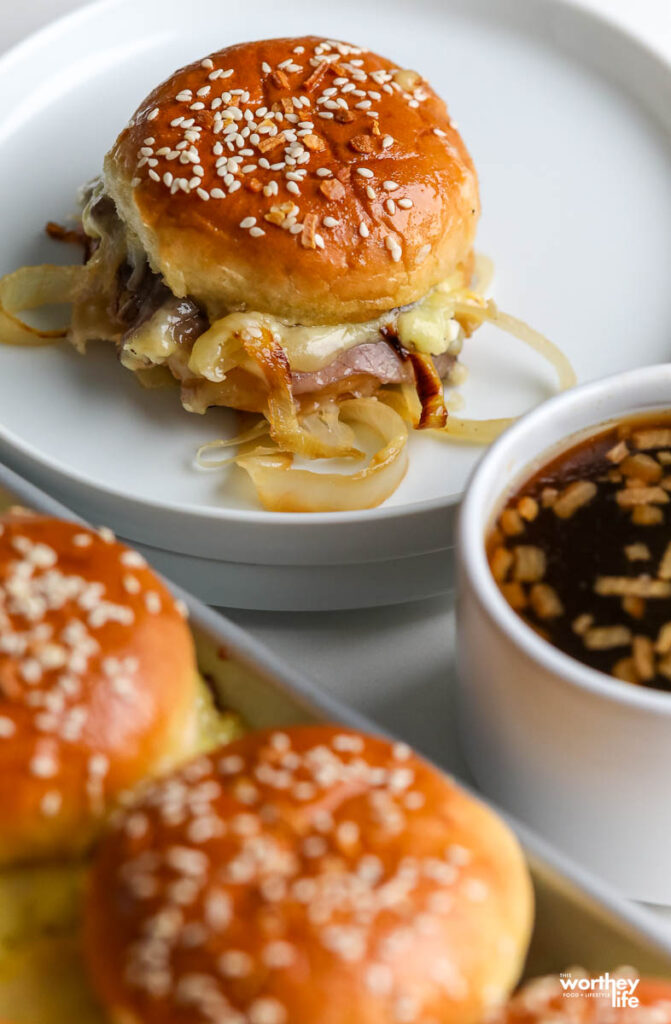 french dip slider on white plate with dip