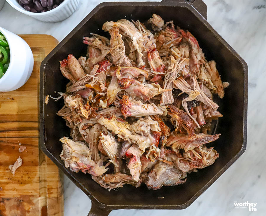 shredded smoked pork in cast iron skillet