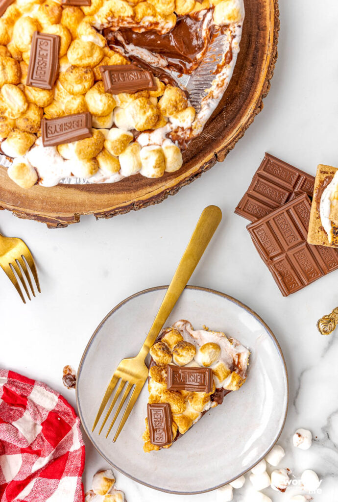 slice of no bake s'mores pie with full pie
