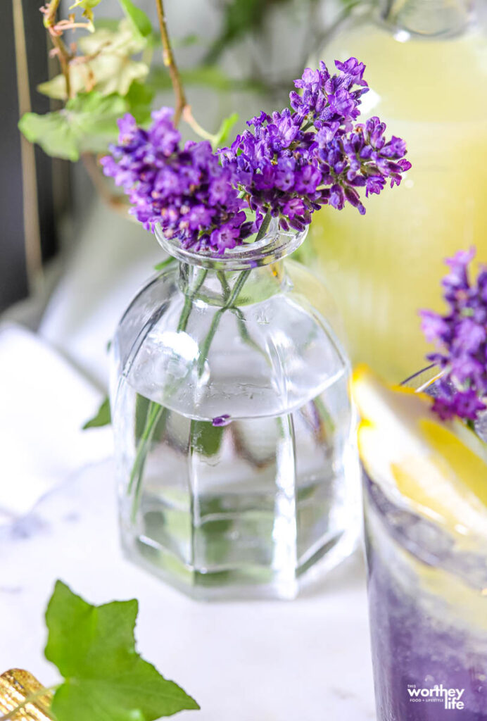 a glass vase filled with lavender flowers