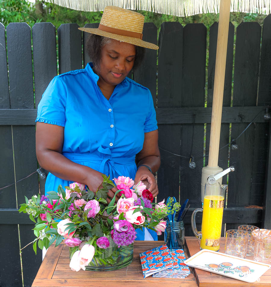 woman preparing flowers for party