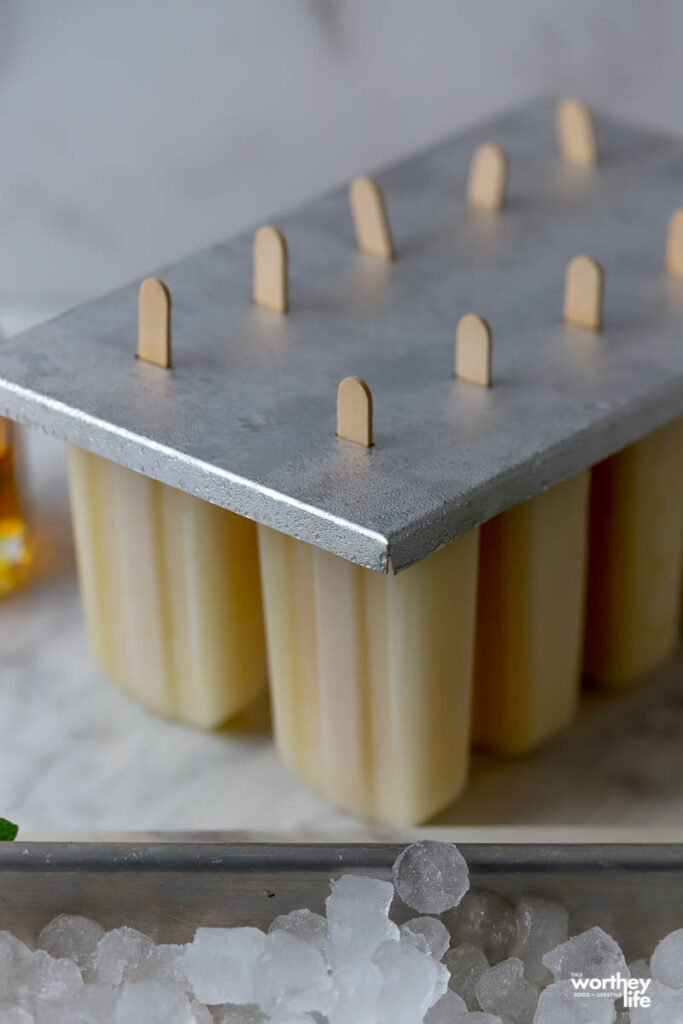 making orange popsicles 