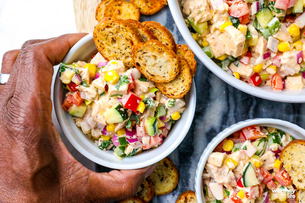 summer chicken salad recipe in a white bowl