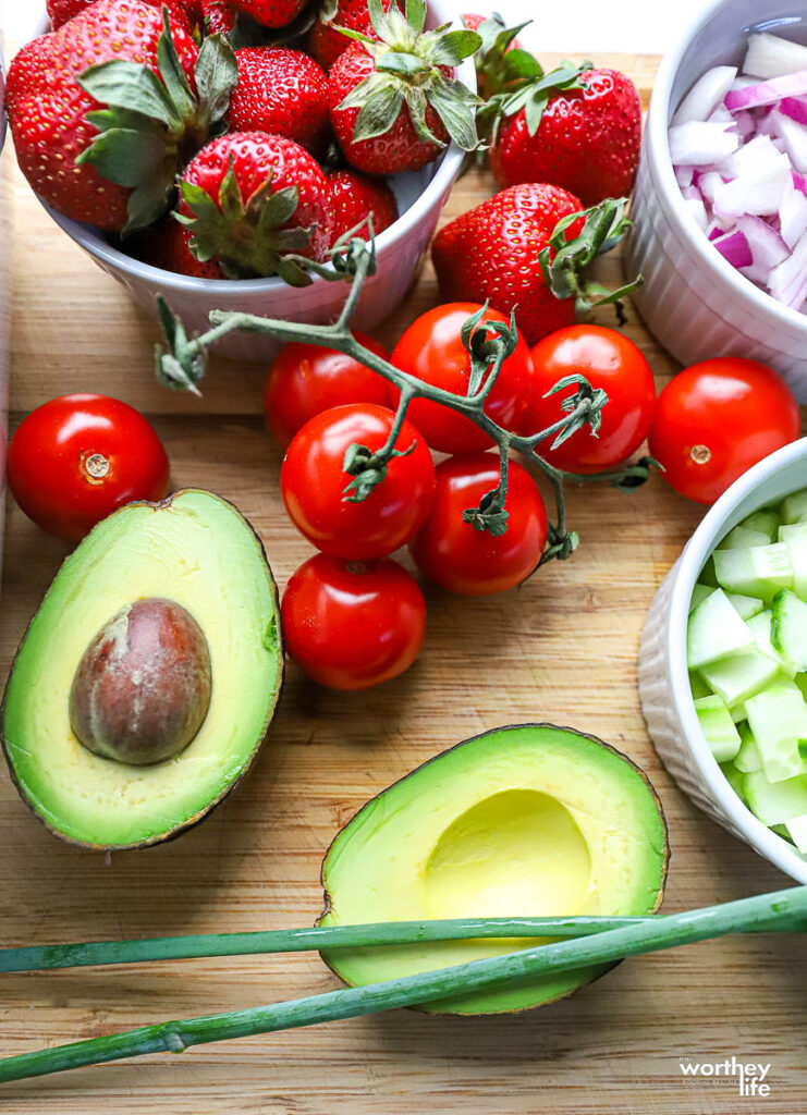 fresh avocado, vine tomatoes, strawberries, and cucumbers