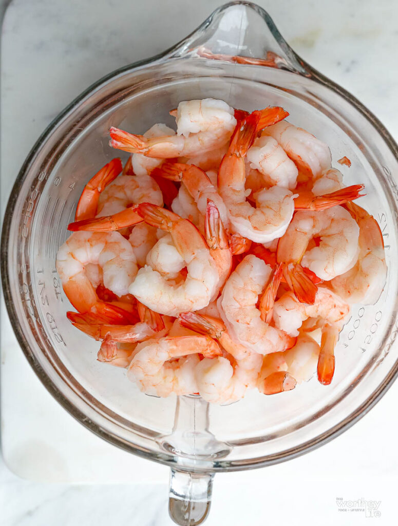 A glass bowl filled with shrimp