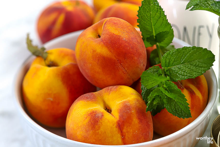 fresh juicy peaches from the Peach Truck in white bowl