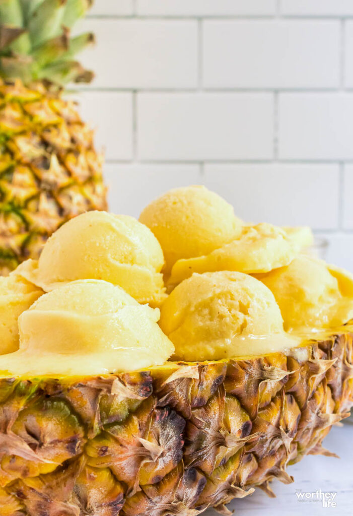 Scoops of homemade ice cream in a fresh pineapple