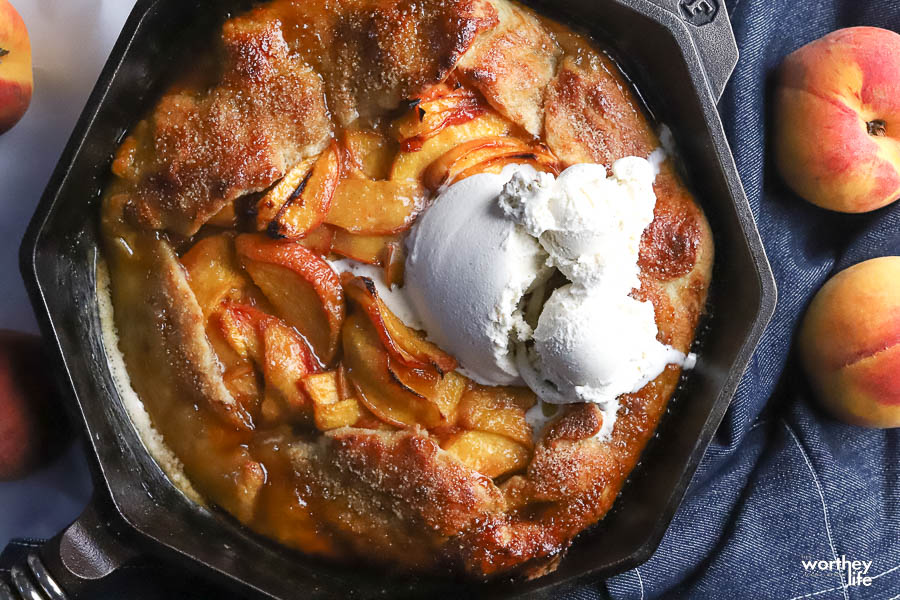 a peach galette served with melting ice cream