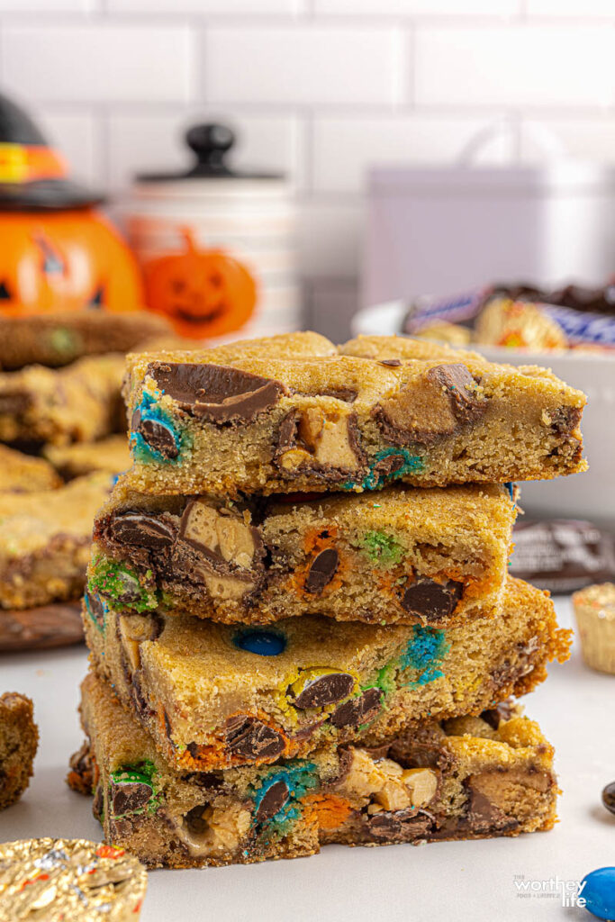 halloween cookie bars stacked on white background