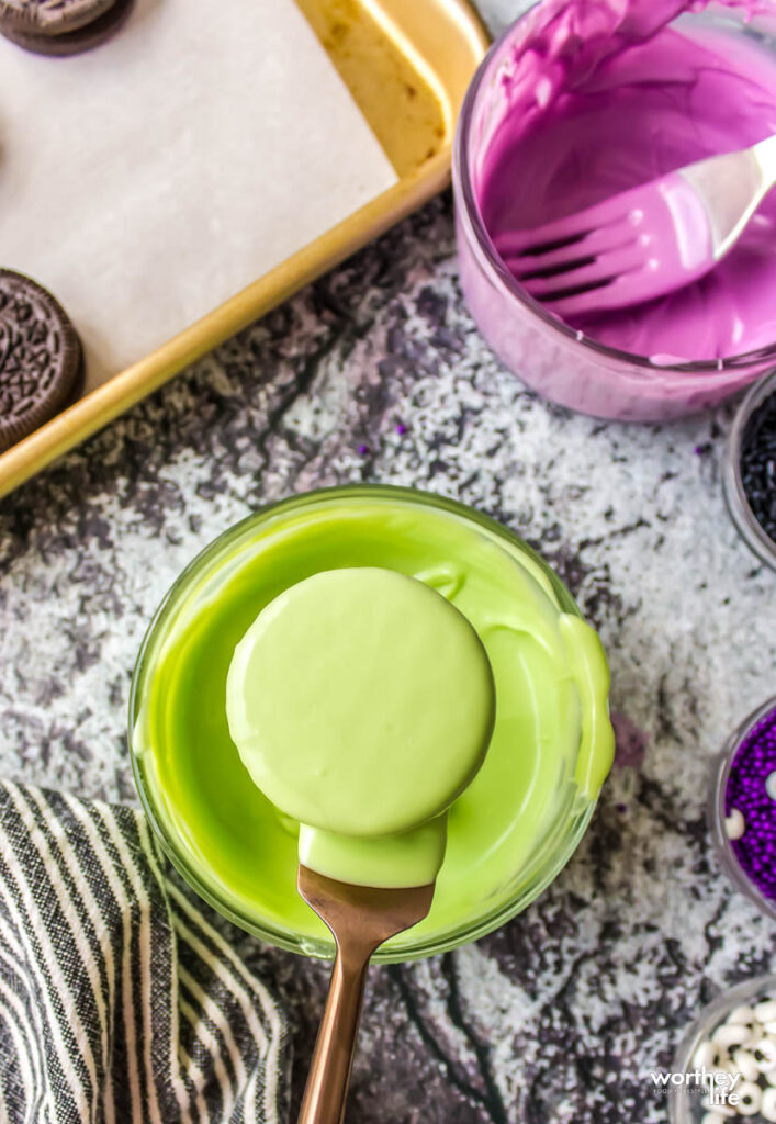 oreos dipping in green food coloring