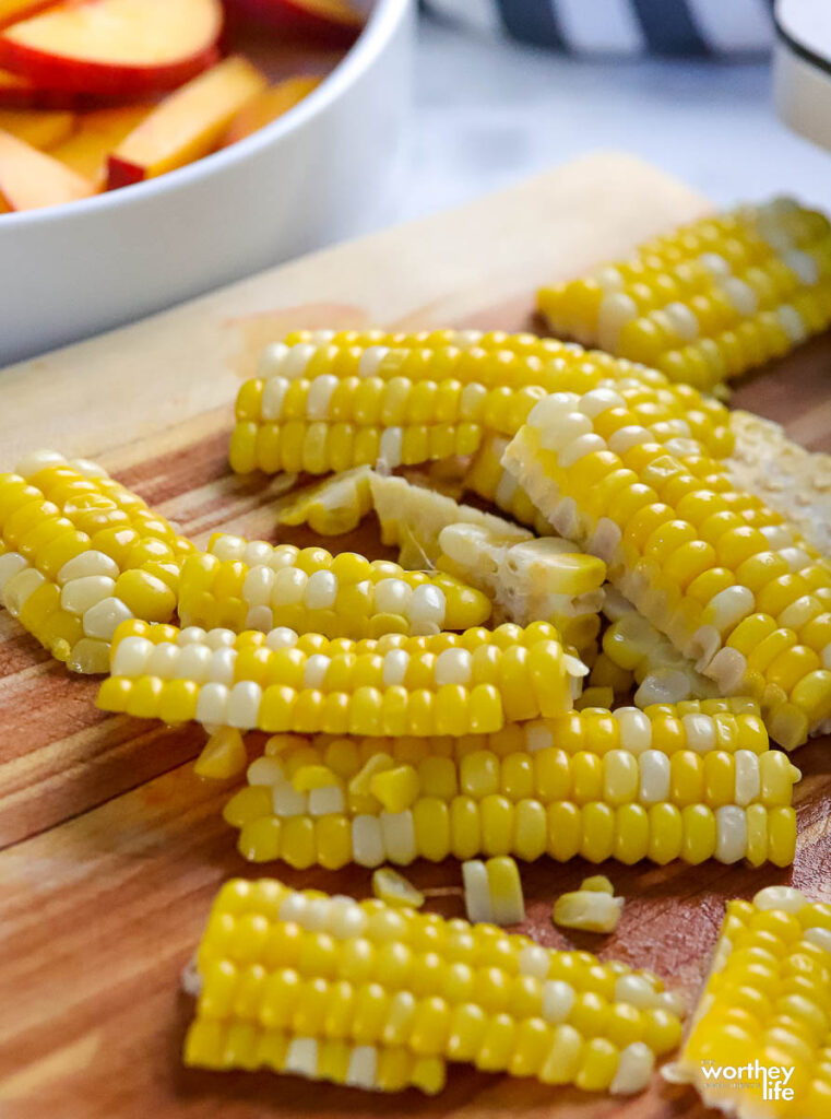 fresh corn on cutting board