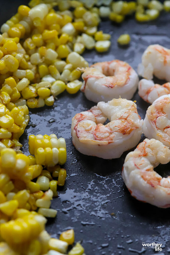 fresh corn and shrimp in skillet