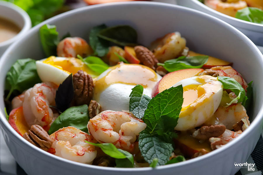 A side view of our easy to make Peach Burrata Shrimp Salad