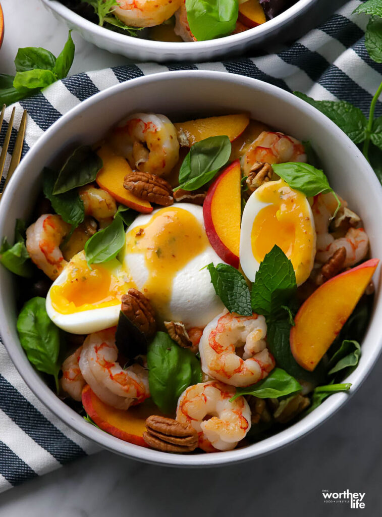 a white salad bowl filled with a delicious salad