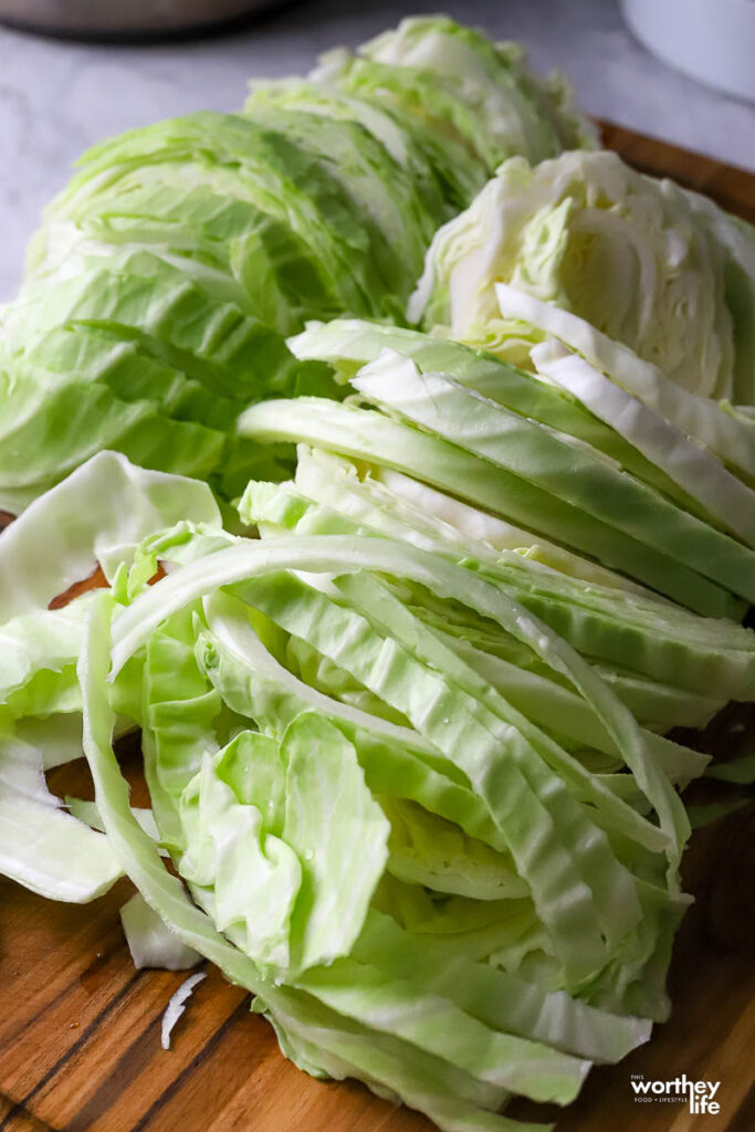 A cutting board and chopped cabbage