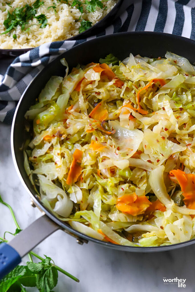 Fried cabbage in a skillet and ready to eat