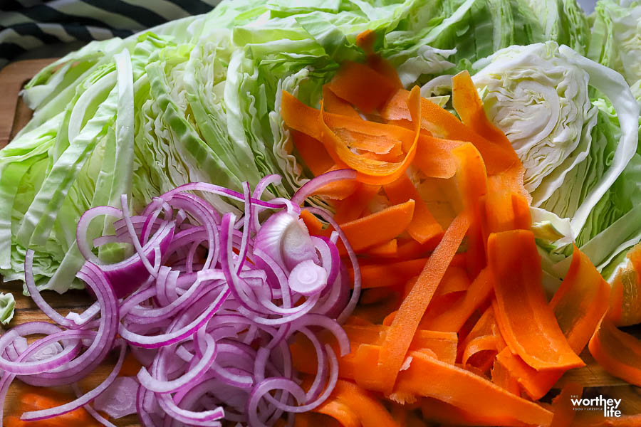 a mixture of chopped cabbage, red onion, and carrots