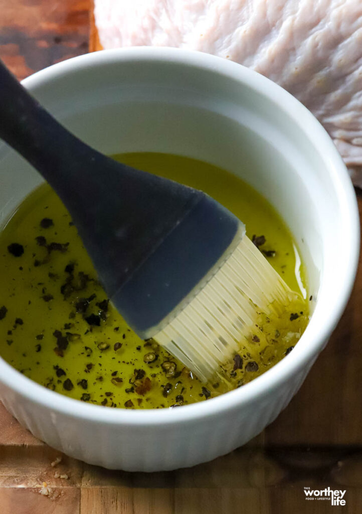 seasonings and olive oil in a white bowl