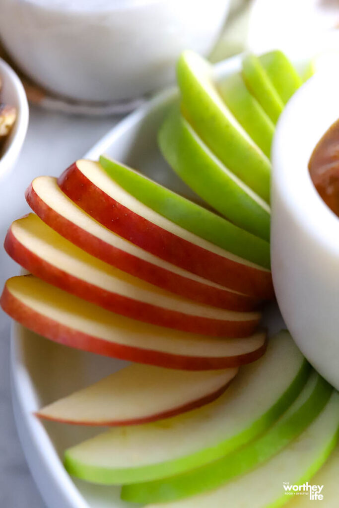 sliced apples on white board