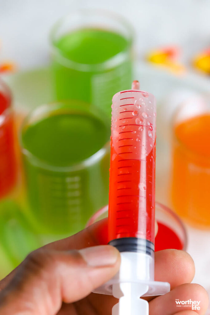 a toy syringe filled with a kid-friendly drink