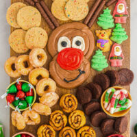 How to make a Reindeer Buttercream Board filled with holiday sweets and chocolate buttercream frosting on wooden board